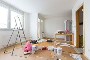 Home renovation in room full of painting tools