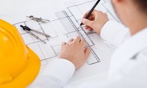 Closeup cropped image of a young male architect working on blueprints spread out on a table